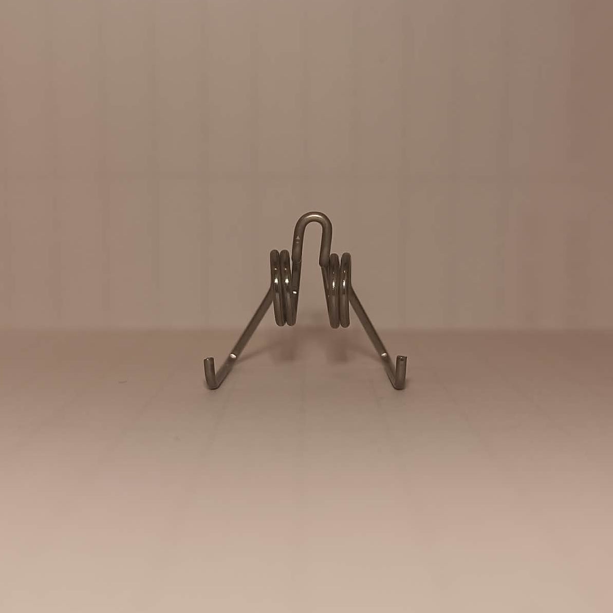 Pad separation spring
